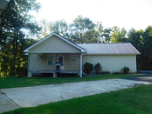 6905 Lower Thomaston Road Macon, GA 31220 - Photo 2 of 18 a front view of a house with garden