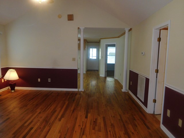 6905 Lower Thomaston Road Macon, GA 31220 - Photo 12 of 18 a view of a livingroom with wooden floor and a fireplace