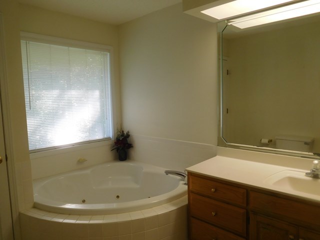 6905 Lower Thomaston Road Macon, GA 31220 - Photo 14 of 18 a bathroom with a tub