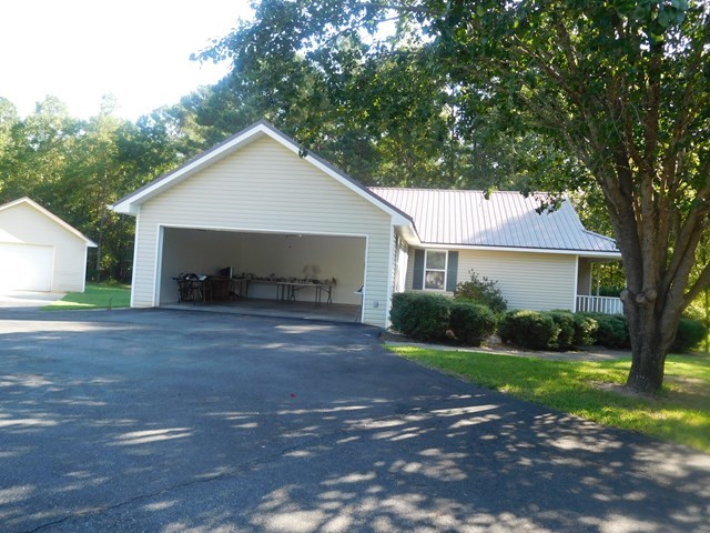6905 Lower Thomaston Road Macon, GA 31220 - Photo 3 of 18 a front view of a house with yard and green space