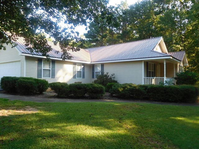 6905 Lower Thomaston Road Macon, GA 31220 - Photo 4 of 18 a front view of a house with a garden