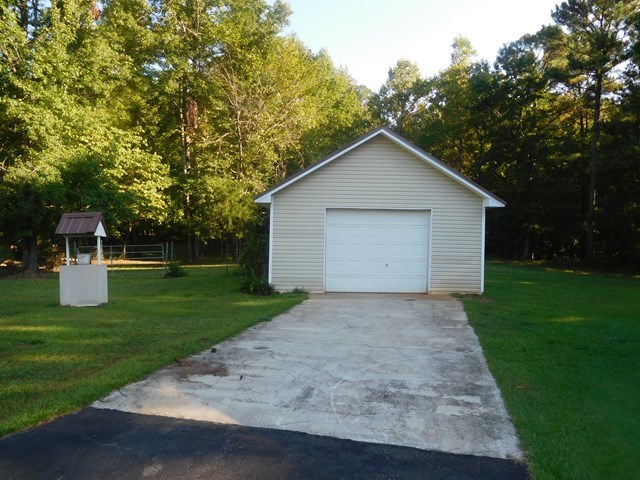 6905 Lower Thomaston Road Macon, GA 31220 - Photo 5 of 18 a view of a house with a yard