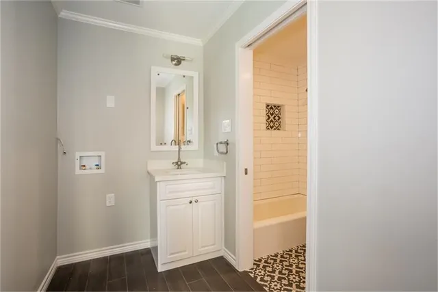 a bathroom with a sink a mirror and a shower