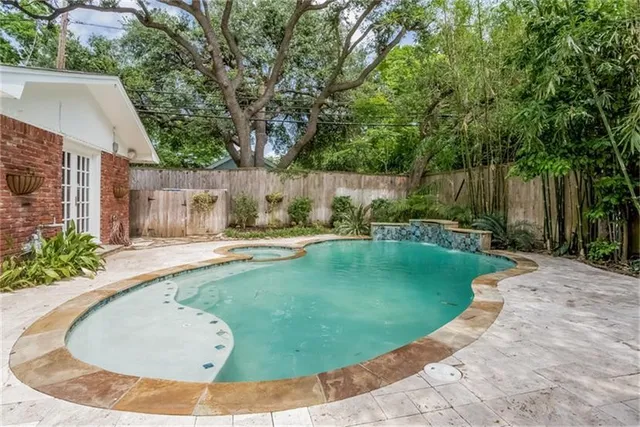 a view of a swimming pool with a patio