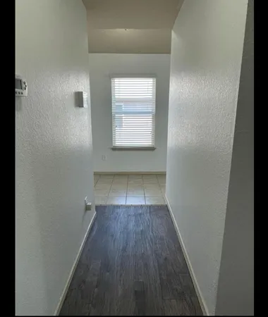 a kitchen with a sink cabinets and refrigerator