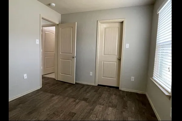 a kitchen with a refrigerator and a sink