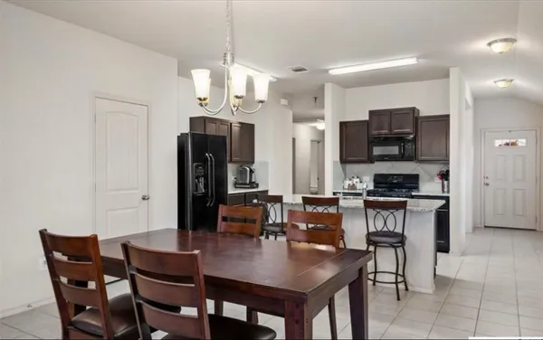 a view of a dining room with furniture