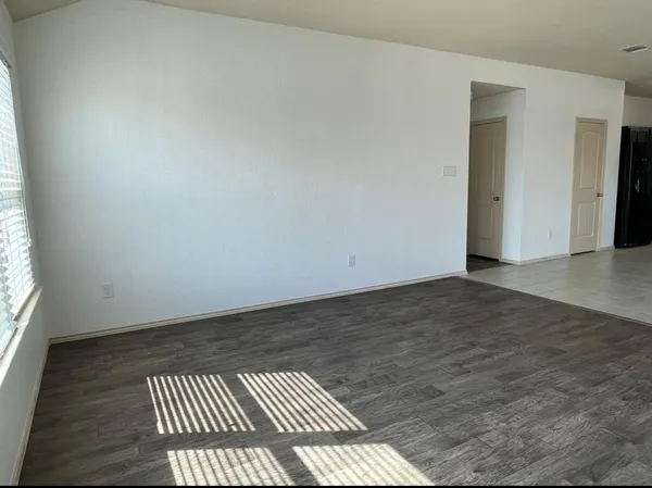 a view of an empty room and window