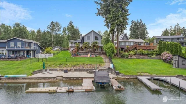an aerial view of a house with a garden and trees