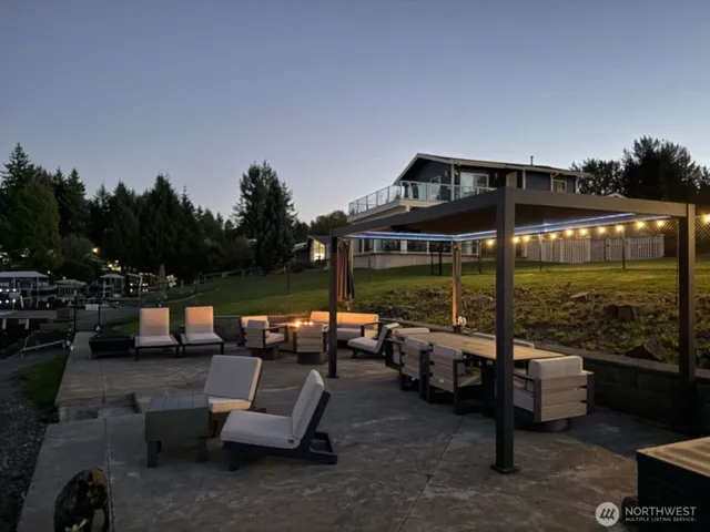 a view of swimming pool with outdoor seating and couches in the patio