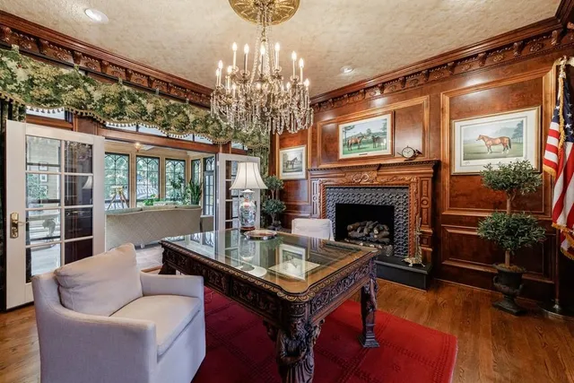 a view of living room with furniture and a fireplace