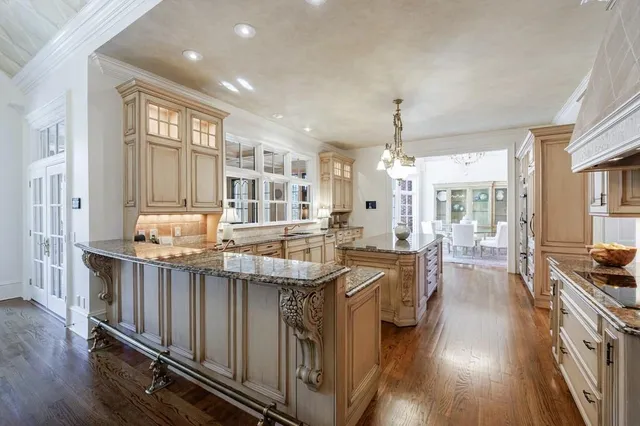 a bedroom with bed and a large window