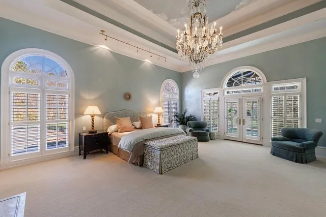a bathroom with a granite countertop sink mirror vanity and toilet
