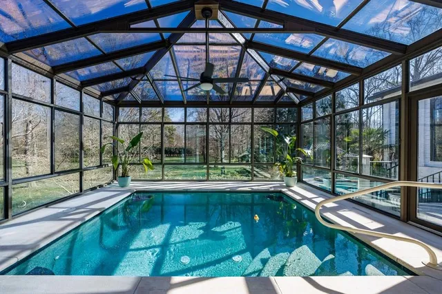 a view of a swimming pool with a porch