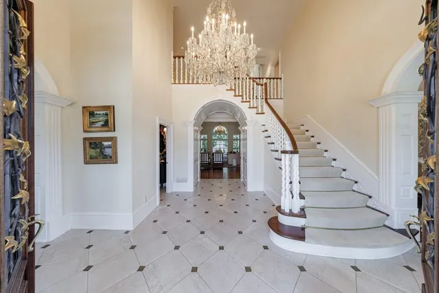 a living room with furniture a fireplace and a window