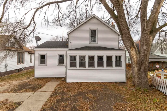 a house with trees in front of it