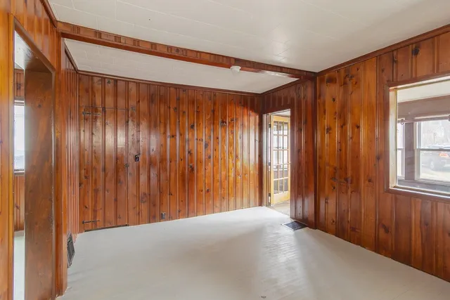 a view of an empty room with windows