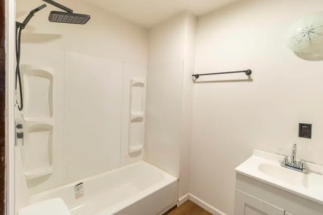 a bathroom with a sink and shower