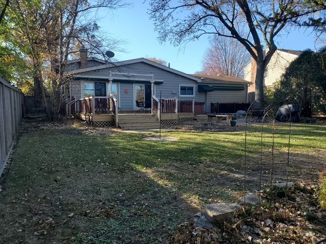 a view of a house with a yard porch and sitting area