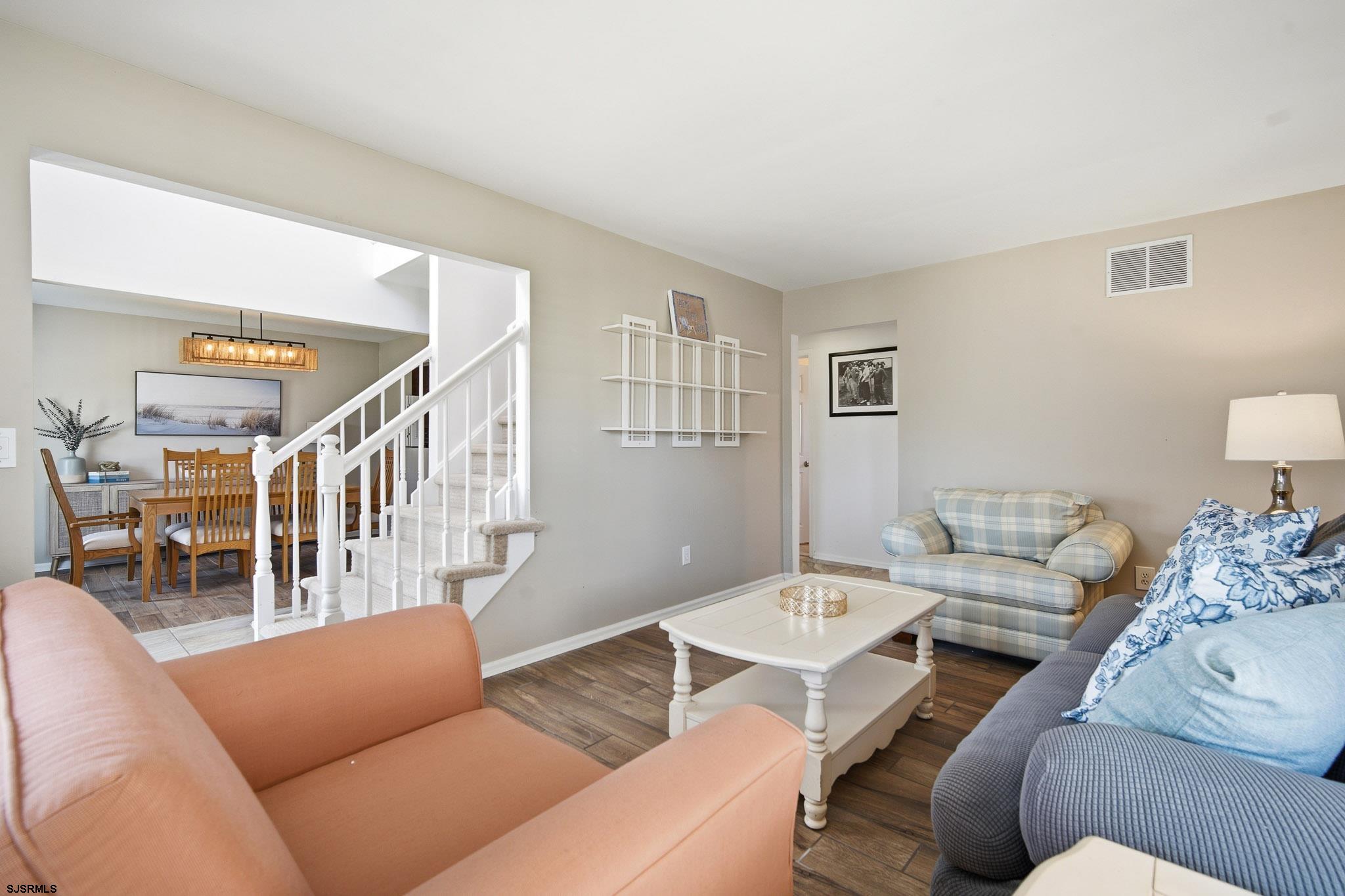 214 Hagen Road Brigantine, NJ 08203 - Photo 7 of 34 a living room with furniture and wooden floor