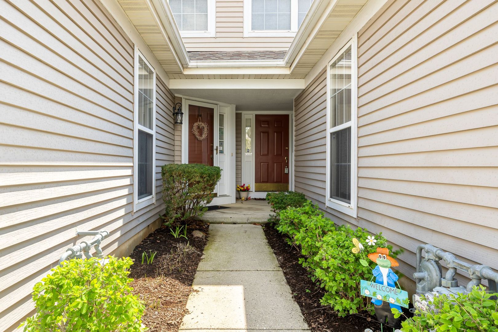 2067 Peach Tree Lane Algonquin, IL 60102 - Photo 2 of 18 a front view of a house with a yard