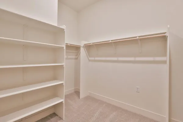 a view of an empty walk in closet