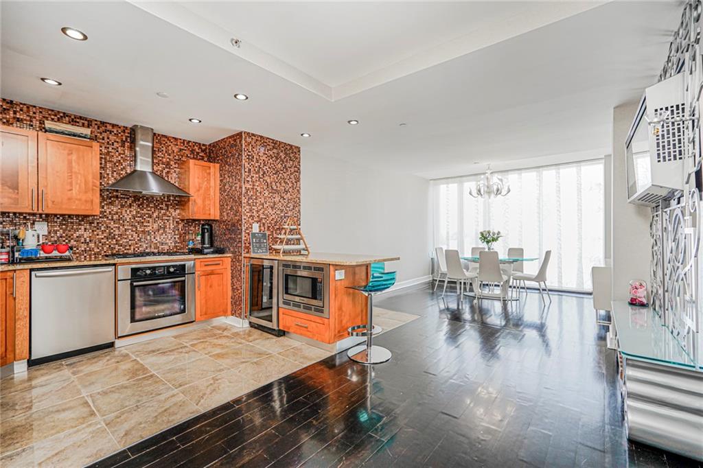 1702 Avenue Z, Unit 6B Brooklyn, NY 11235 - Photo 13 of 40 a open kitchen with stainless steel appliances granite countertop a stove and cabinets