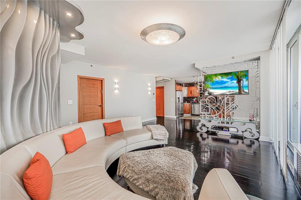 1702 Avenue Z, Unit 6B Brooklyn, NY 11235 - Photo 14 of 40 a living room with furniture and a flat screen tv