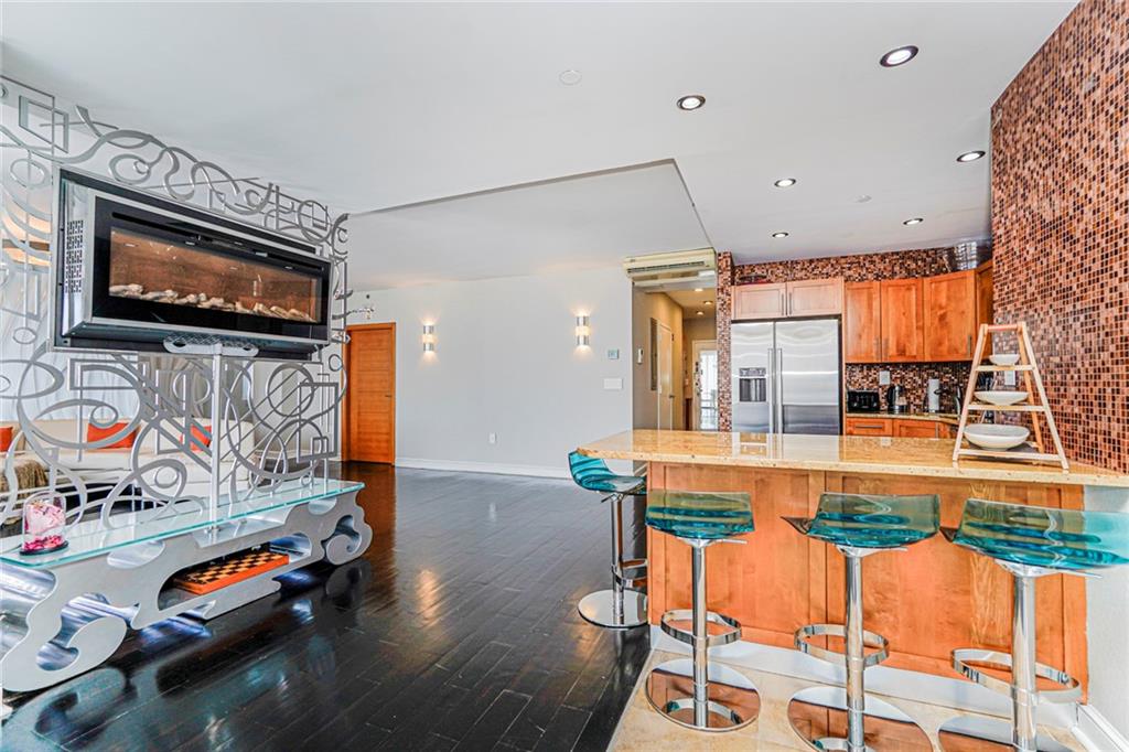 1702 Avenue Z, Unit 6B Brooklyn, NY 11235 - Photo 15 of 40 a living room with furniture and flat screen tv