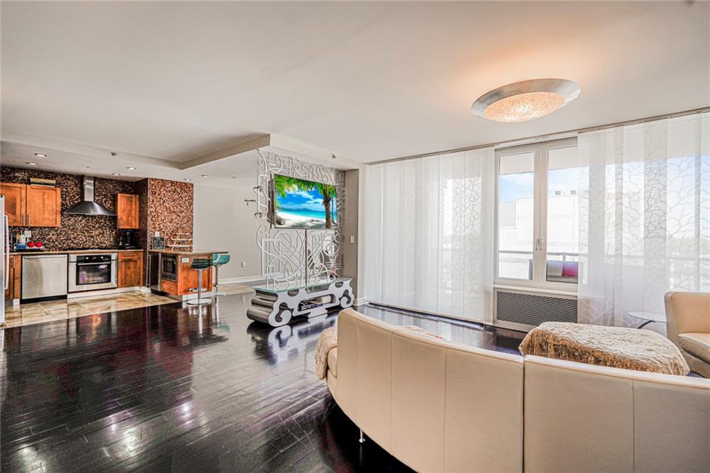 1702 Avenue Z, Unit 6B Brooklyn, NY 11235 - Photo 19 of 40 a living room with furniture and a large window