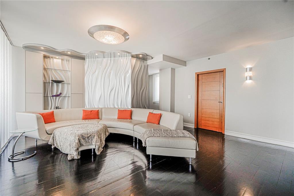 1702 Avenue Z, Unit 6B Brooklyn, NY 11235 - Photo 20 of 40 a living room with furniture and a wooden floor