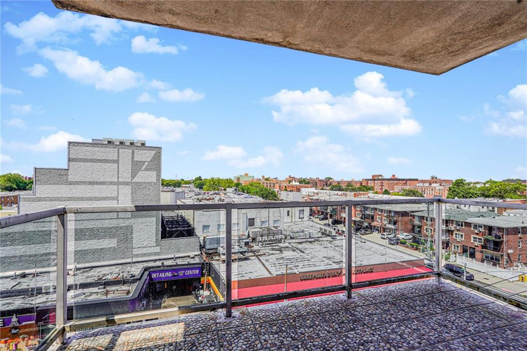 1702 Avenue Z, Unit 6B Brooklyn, NY 11235 - Photo 26 of 40 a view of a terrace with wooden floor and fence