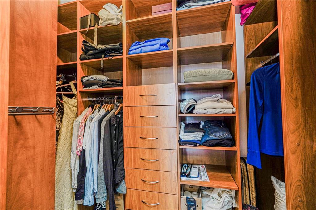 1702 Avenue Z, Unit 6B Brooklyn, NY 11235 - Photo 29 of 40 a view of walk in closet with clothes and shoes