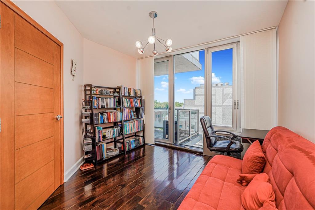 1702 Avenue Z, Unit 6B Brooklyn, NY 11235 - Photo 31 of 40 a living room with furniture a rug and a chandelier