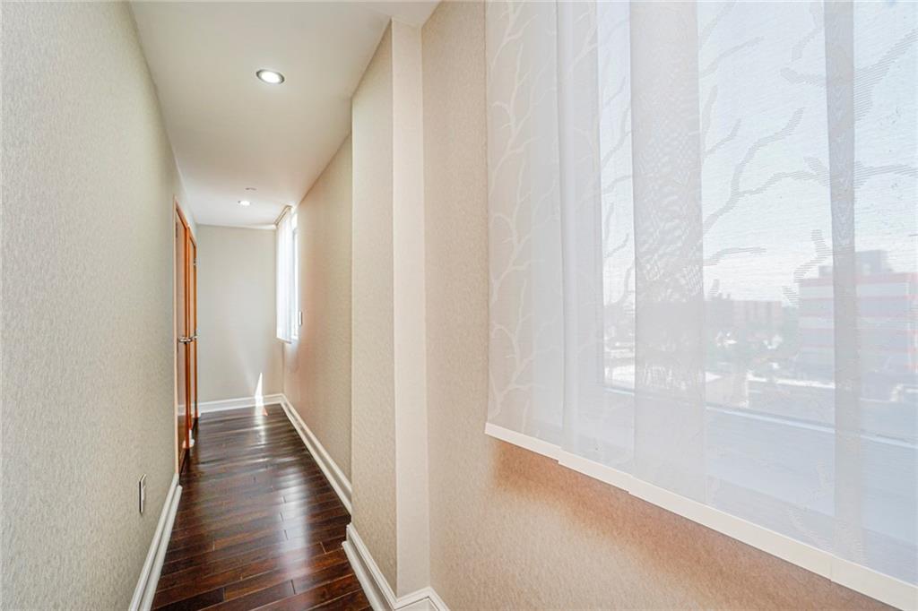 1702 Avenue Z, Unit 6B Brooklyn, NY 11235 - Photo 32 of 40 a view of a hallway with wooden floor