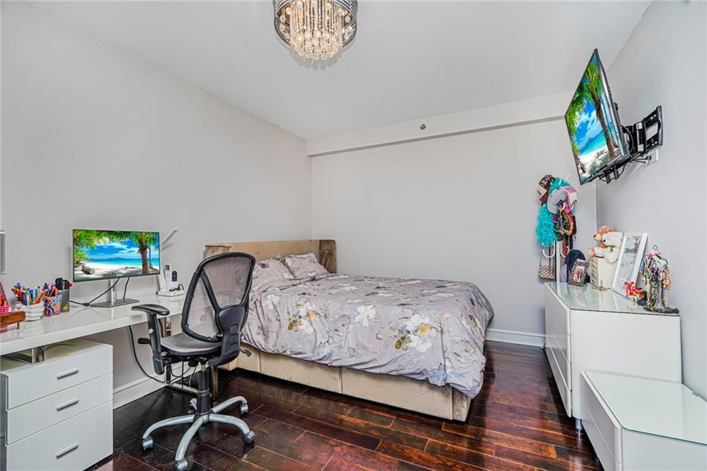 1702 Avenue Z, Unit 6B Brooklyn, NY 11235 - Photo 36 of 40 a bedroom with a bed and a desk