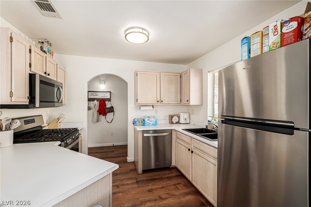 698 South Racetrack Road, Unit 124 Henderson, NV 89015 - Photo 12 of 29 Kitchen with stainless steel appliances, light wood finish cabinets, and light countertops