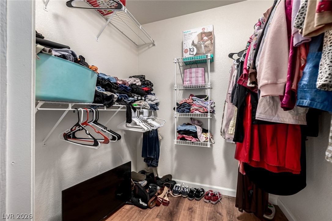 698 South Racetrack Road, Unit 124 Henderson, NV 89015 - Photo 22 of 29 Walk in closet with light wood-type flooring