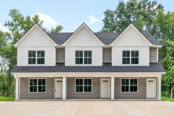 a view of house with yard