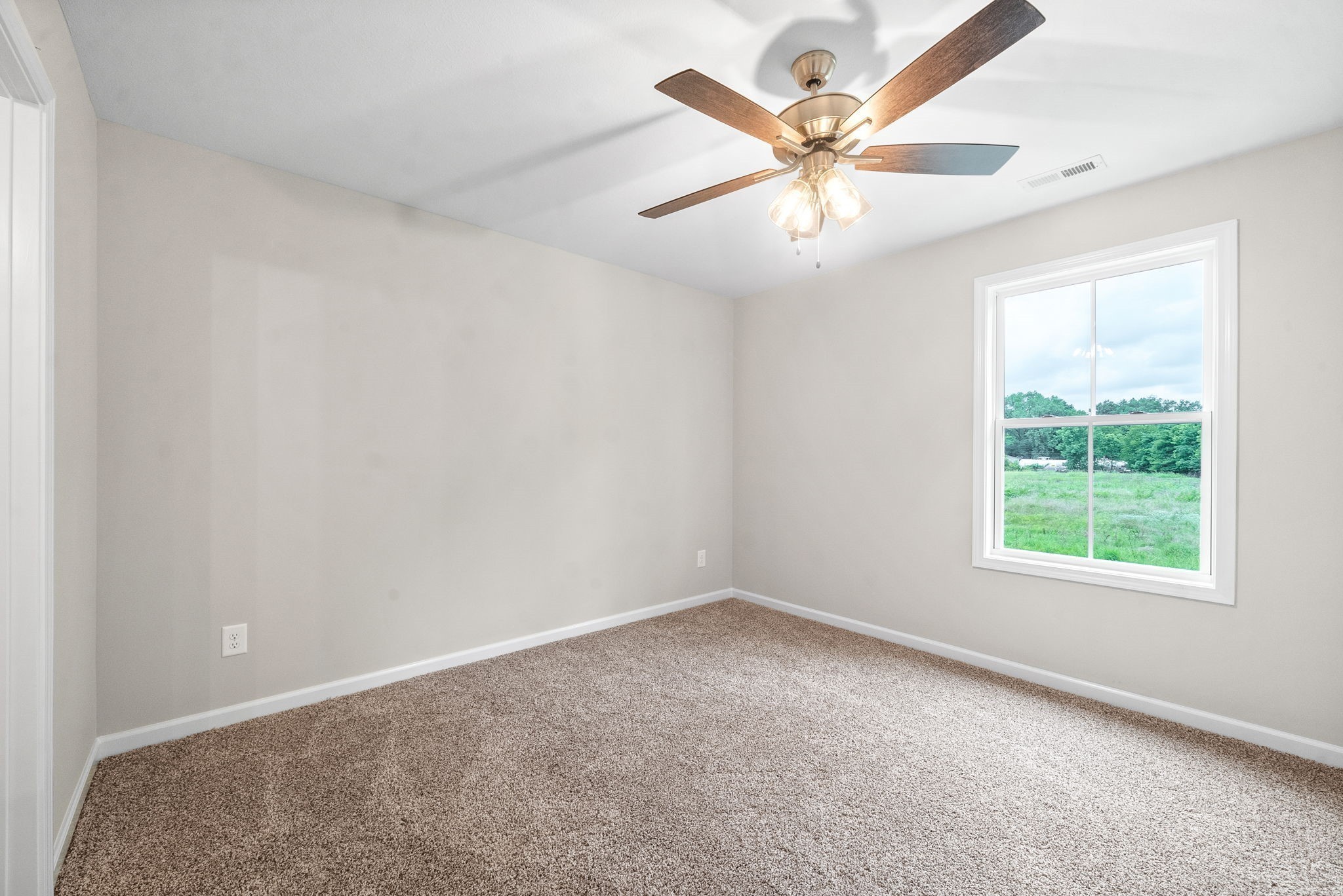 512 Edlin Street Clarksville, TN 37043 - Photo 14 of 20 an empty room with a window and a fan