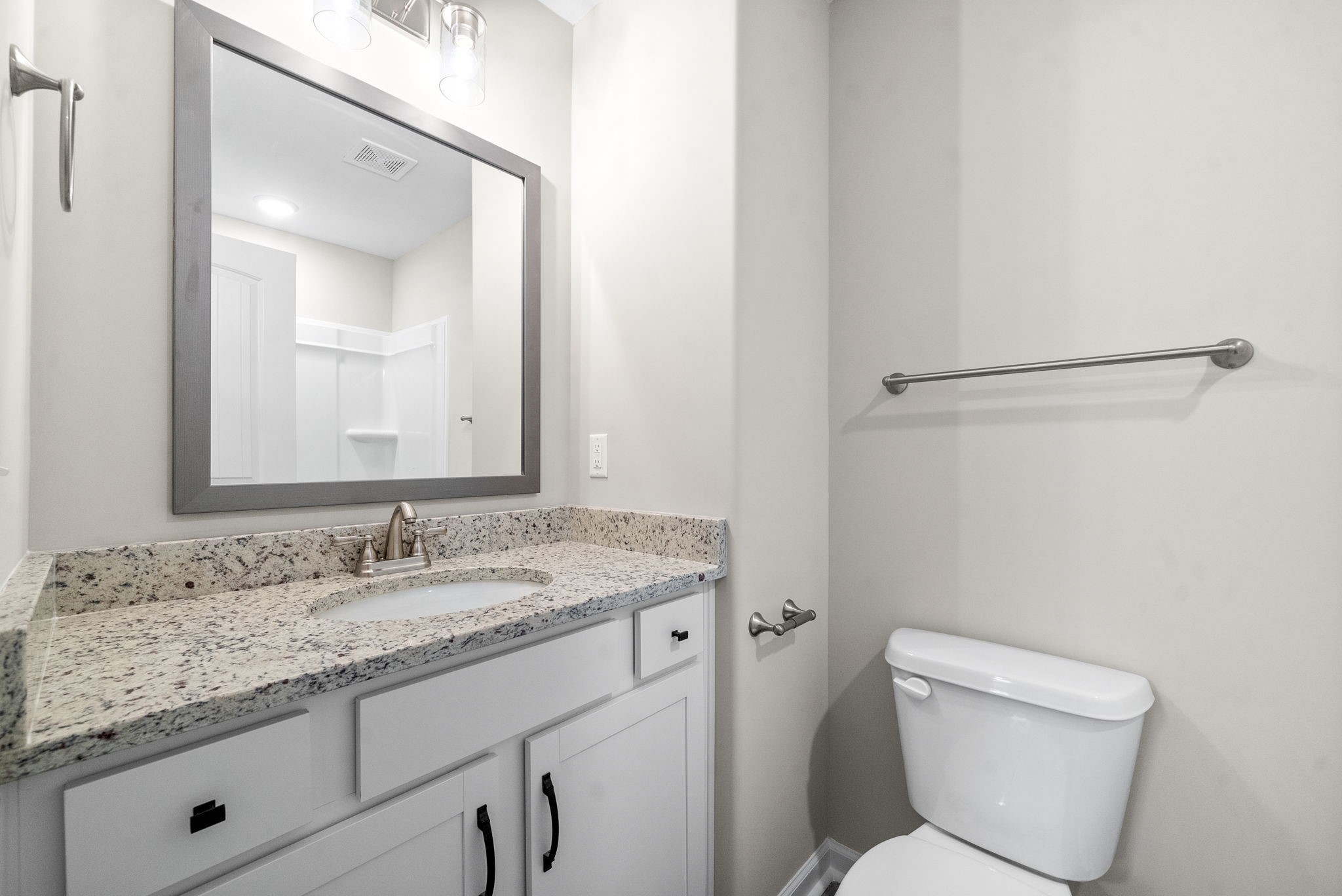 512 Edlin Street Clarksville, TN 37043 - Photo 16 of 20 a bathroom with a granite countertop toilet sink and mirror