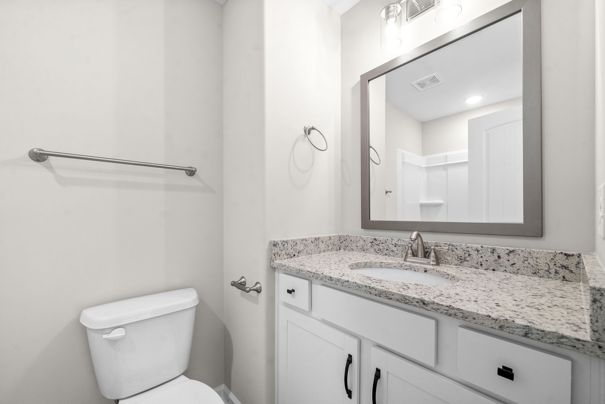 512 Edlin Street Clarksville, TN 37043 - Photo 20 of 20 a bathroom with a granite countertop sink a toilet and a mirror