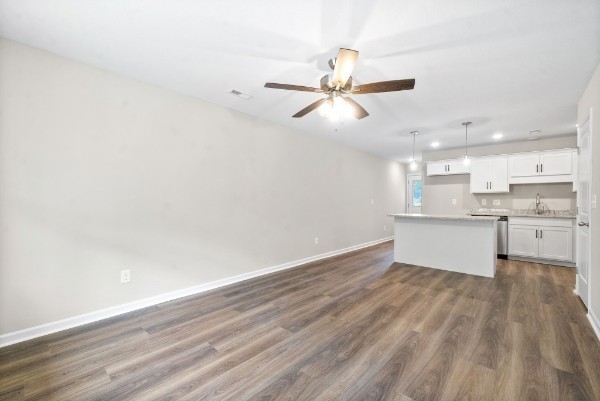 512 Edlin Street Clarksville, TN 37043 - Photo 3 of 20 a view of a kitchen with wooden floor and a sink