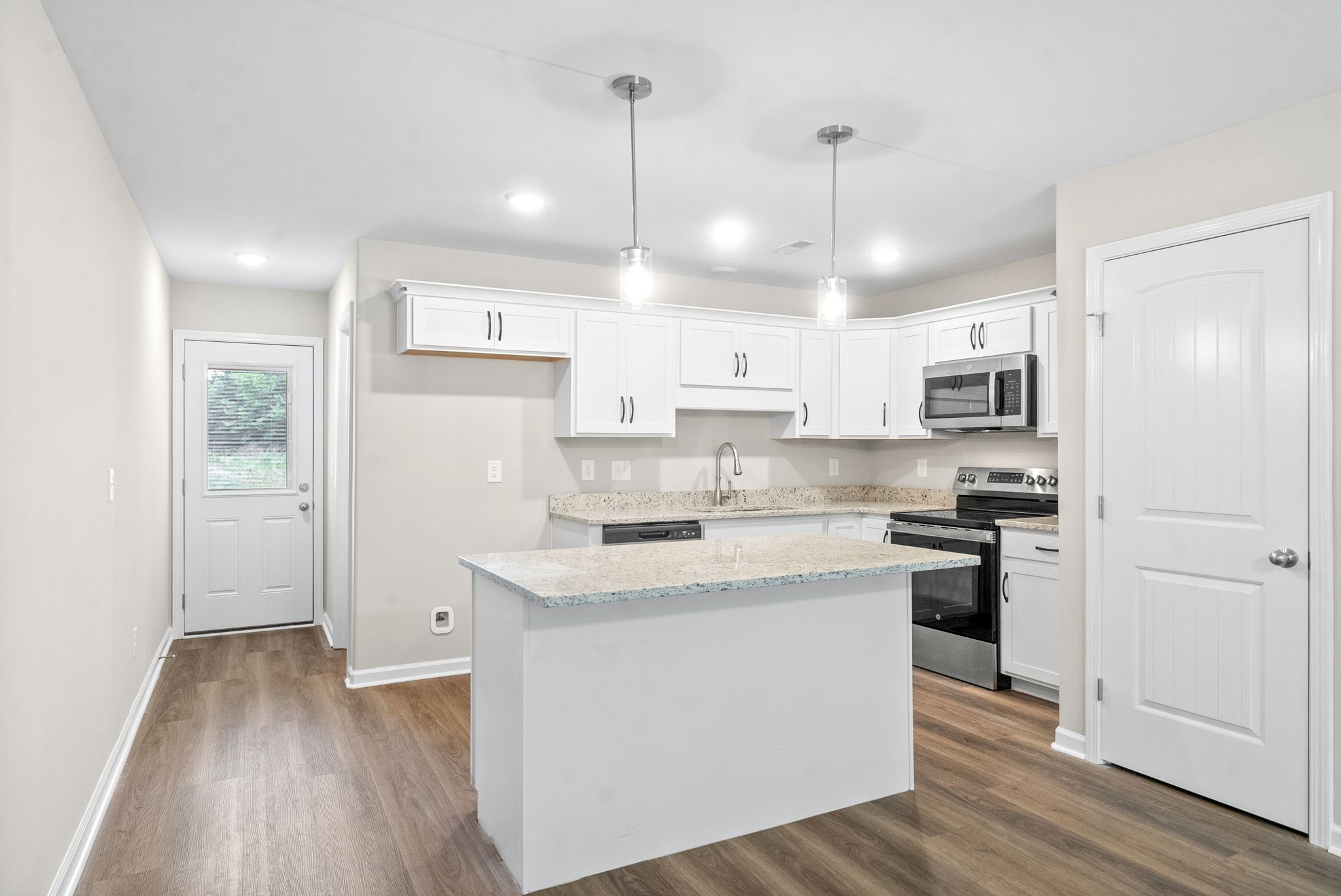 512 Edlin Street Clarksville, TN 37043 - Photo 7 of 20 a kitchen with kitchen island a sink stainless steel appliances and cabinets