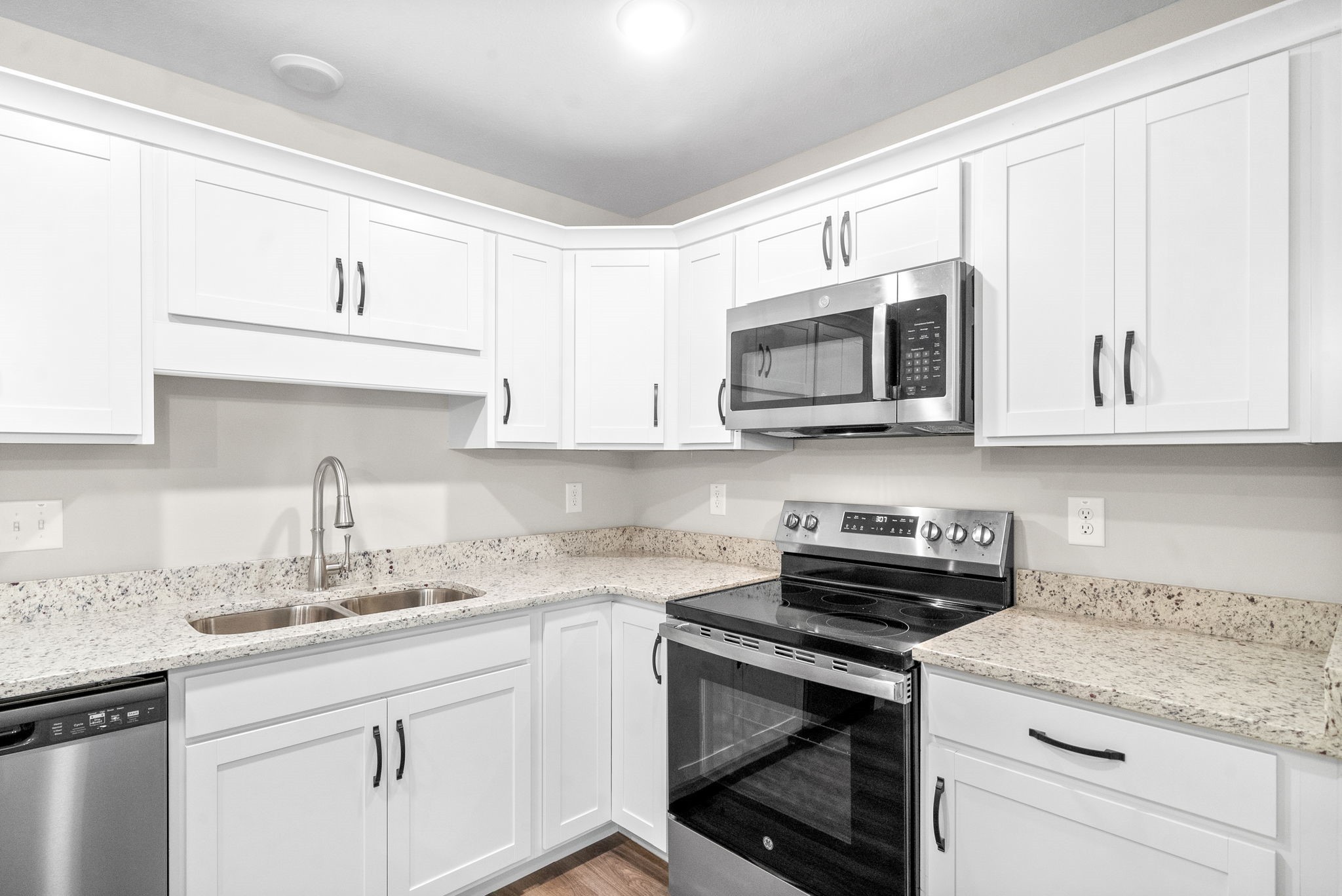 512 Edlin Street Clarksville, TN 37043 - Photo 10 of 20 a kitchen with granite countertop white cabinets white stainless steel appliances and a sink
