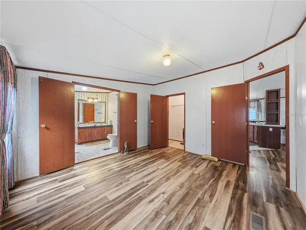 a view of a livingroom with wooden floor