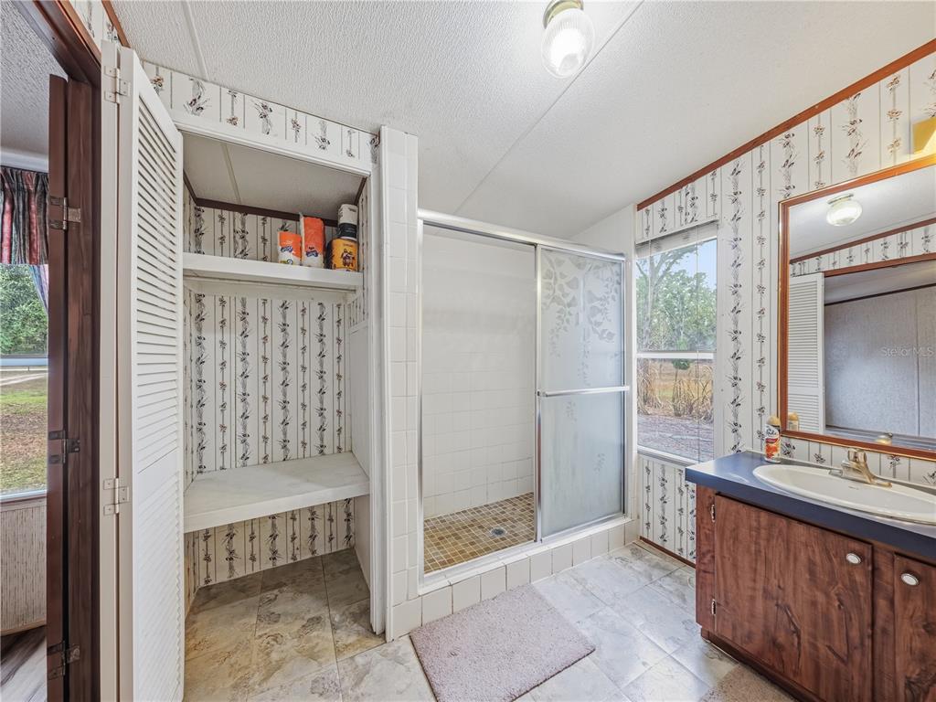 21210 137th Drive O'Brien, FL 32071 - Photo 14 of 49 a bathroom with a bathtub and a sink