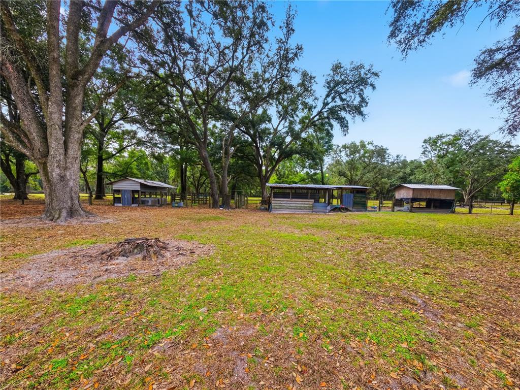 21210 137th Drive O'Brien, FL 32071 - Photo 27 of 49 a view of a house with a yard