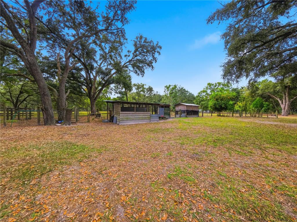21210 137th Drive O'Brien, FL 32071 - Photo 28 of 49 a view of outdoor space with deck and yard