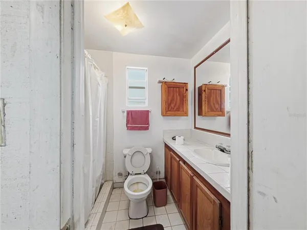 a front view of house with yard and trees